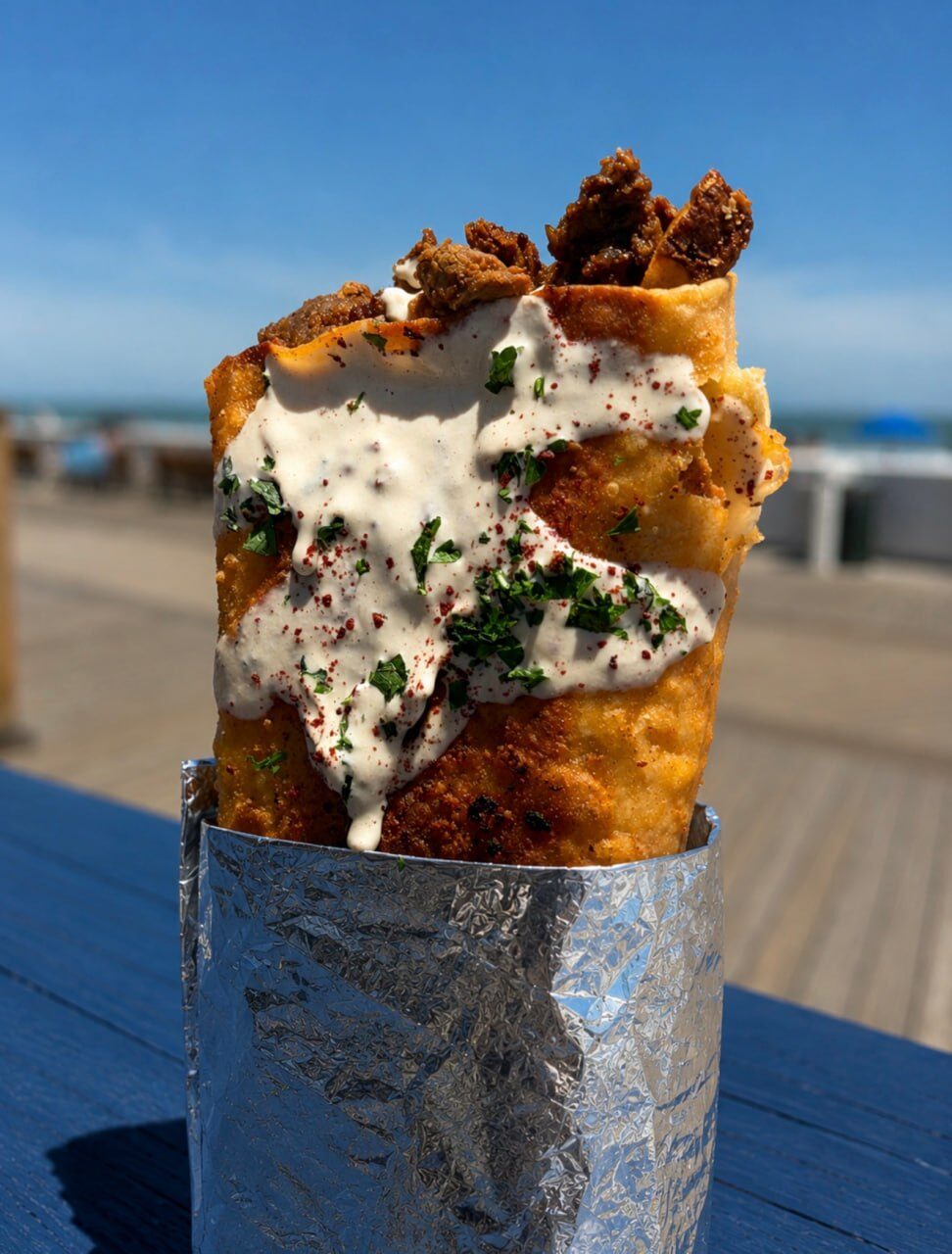 Crispy pita wrap with tahini, sumac and parsley